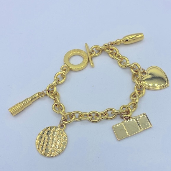 Signed Estée Lauder Gold Tone Charm Bracelet With Five Charms NWOT Size 7” - Picture 1 of 11